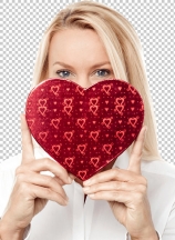 Woman holds a heart shape to her face