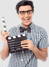 Smiling man holding a movie clap